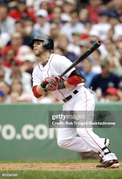 Dustin Pedroia of the Boston Red Sox hits a solo home run in the 3rd inning against the Milwaukee Brewers on May 18, 2008 at Fenway Park in Boston,...