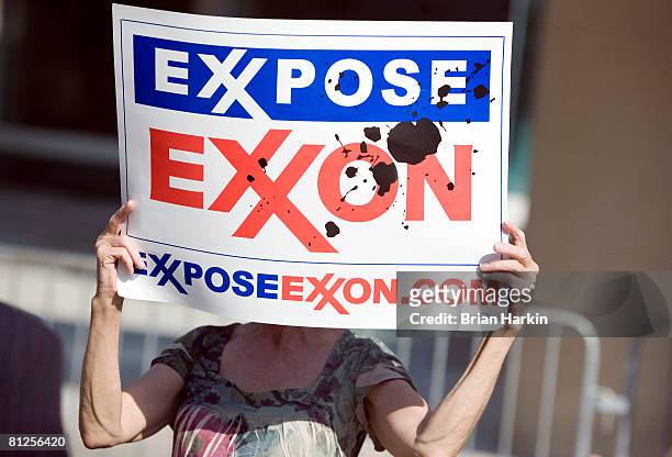 Protester holds a sign outside of the ExxonMobil annual shareholders meeting at the Morton H. Meyerson Symphony Center May 28, 2008 in Dallas, Texas....