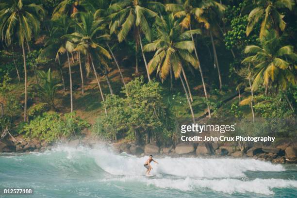 sri lanka paradise surfer - breaking waves stock pictures, royalty-free photos & images