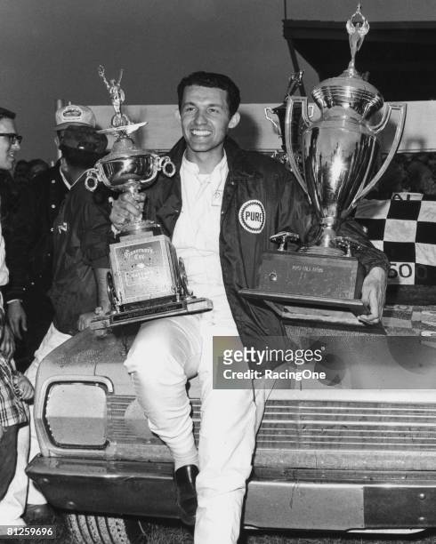 Richard Petty driver of the STP Plymouth celebrates in victory lane after winning the Winston Cup Daytona 500 on February 27, 1966 at the Daytona...