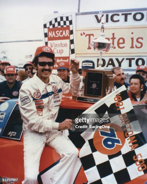 Richard Petty driver of the STP Buick celebrates in victory lane after winning the Winston Cup Daytona 500 on February 17, 1974 at the Daytona...