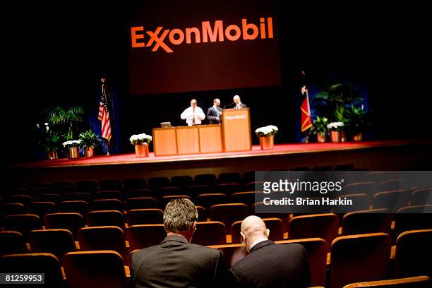Two men talk after the end of the ExxonMobil annual shareholders meeting at the Morton H. Meyerson Symphony Center May 28, 2008 in Dallas, Texas. A...