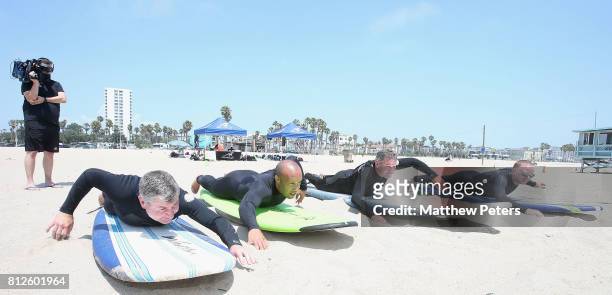 Manchester United legends Denis Irwin, Bryan Robson, Mikael Silvestre and David May take part in a surfing lesson as part of their pre-season tour of...
