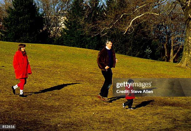 Caroline Kennedy Schlossberg and her husband, Edwin, and daughter, Rose, stoll along Central Park in New York City, January 27, 1990.