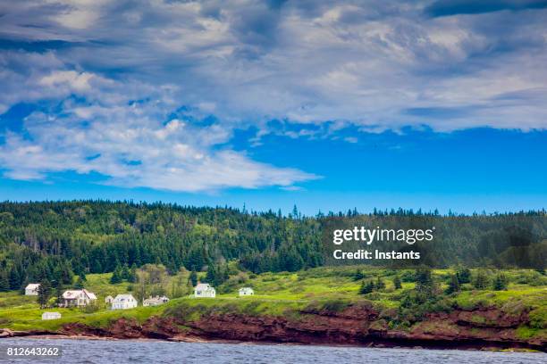 in the beautiful gaspésie region, saint lawrence river bonaventure island in percé, which is part of quebec’s national park system. to the exception of a few buildings used by the government, nobody has lived on the island since 1971. - gaspe peninsula stock pictures, royalty-free photos & images