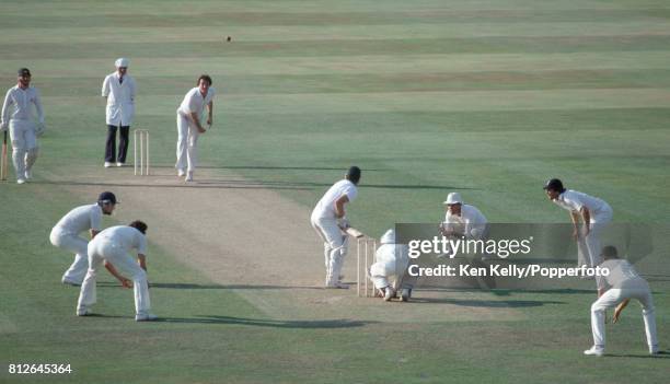 John Emburey of England bowls to Australian batsman Dirk Wellham towards the end of the 1st day of the 6th Test match between England and Australia...