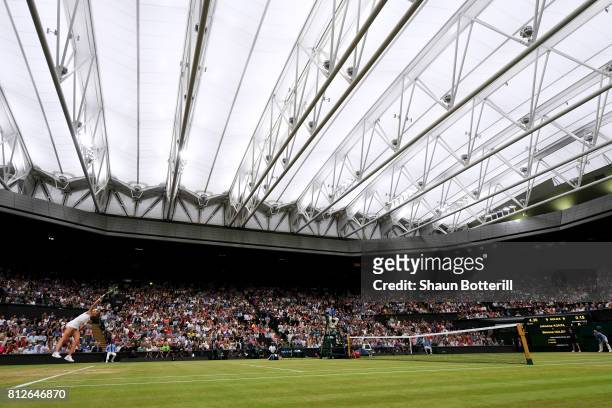 General view of under the centre court roof as Johanna Konta of Great Britain serves during the Ladies Singles quarter final match against Simona...