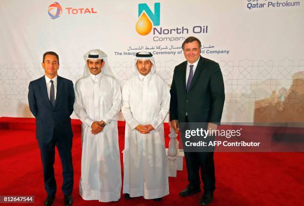 Qatar's Prime Minister Abdullah bin Nasser bin Khalifa al-Thani , Chairman and CEO of French energy company Total, Patrick Pouyanne , and President...