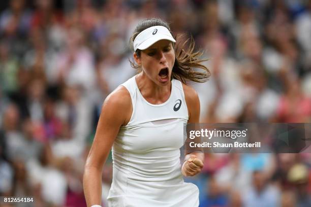 Johanna Konta of Great Britain reacts during the Ladies Singles quarter final match against Simona Halep of Romania on day eight of the Wimbledon...