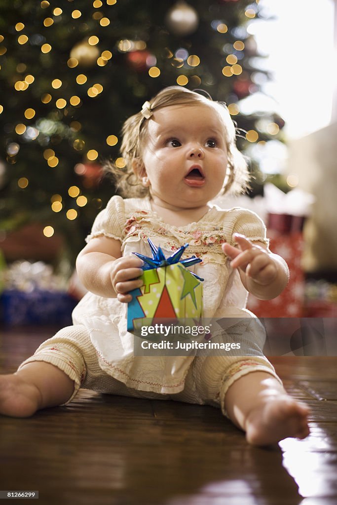 Baby girl with Christmas gift
