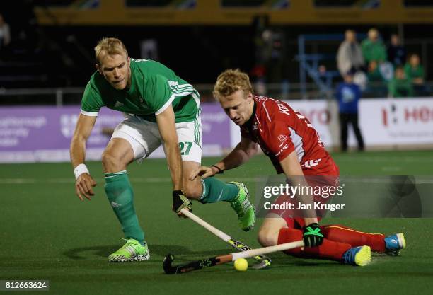 Amaury Keusters of Belgium and Conor Harte of Ireland battle for possession during day 2 of the FIH Hockey World League Semi Finals Pool B match...