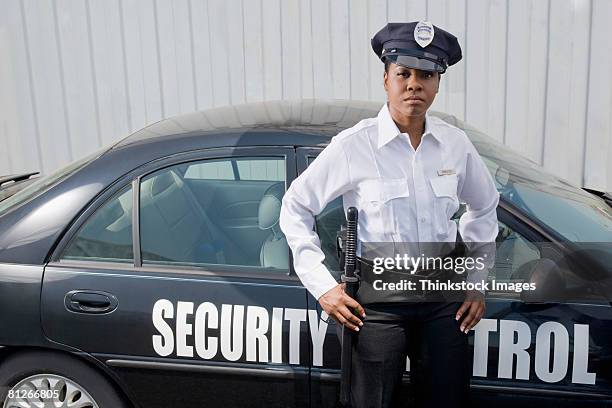 Security Driver Guard Security Guard With Car Photo - Getty Images