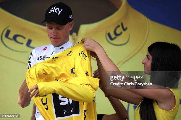 Christopher Froome of Great Britain riding for Team Sky poses for a photo on the podium in the leader's jersey after stage 10 of the 2017 Le Tour de...