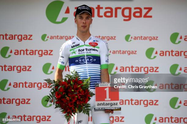 Elie Gesbert of France riding for Team Fortuneo-Oscaro poses for a photo on the podium after winning the most combatitive rider during stage 10 of...