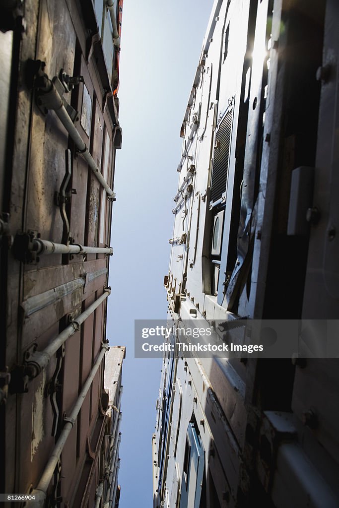 Low angle view of stacked cargo containers