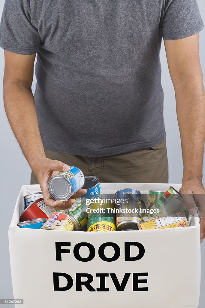 Man holding food drive box