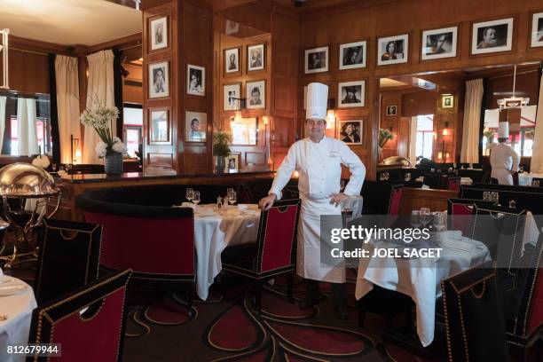 French chef Bruno Gueret poses at his restaurant in the newly-renovated Barriere Le Fouquet's Hotel, on the Champs-Elysees avenue in Paris, on July...