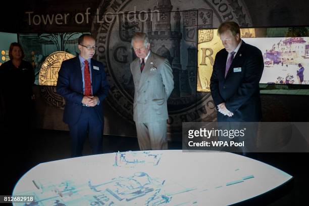 Prince Charles, The Prince of Wales is shown an interactive display by Director of the Royal Mint Museum Dr Kevin Clancy, and Royal Mint CEO Adam...