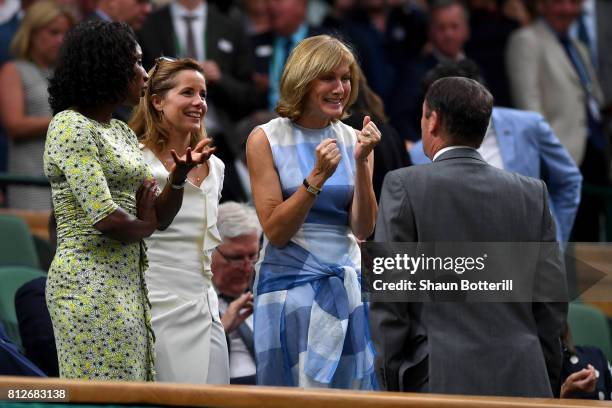 Denise Lewis, Darcey Bussell and Fiona Bruce in discussion with AELTC Chairman Philip Brook in the centre court royal box on day eight of the...