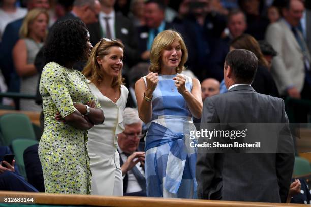 Denise Lewis, Darcey Bussell and Fiona Bruce in discussion with AELTC Chairman Philip Brook in the centre court royal box on day eight of the...