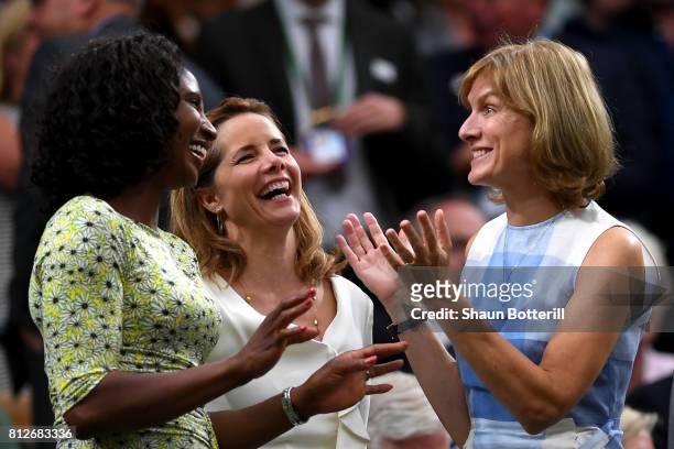 Denise Lewis, Darcey Bussell and Fiona Bruce share a joke in the centre court royal box on day eight of the Wimbledon Lawn Tennis Championships at...