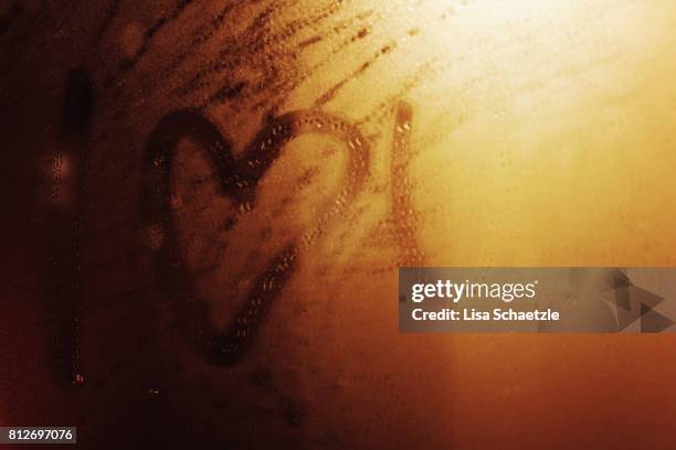 i love you written on a bathroom mirror - mirror steam fotografías e imágenes de stock