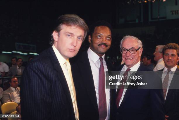 Businessman Donald Trump Minister Jesse Jackson and entrepreneur Malcolm Forbes ringside at Tyson vs Holmes Convention Hall in Atlantic City, New...