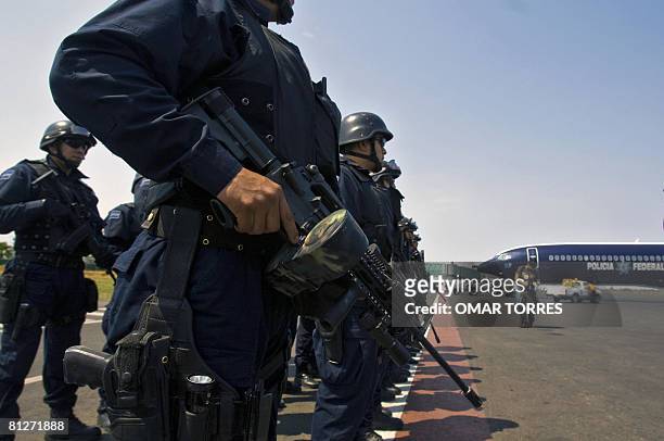 Some of the 200 new members of the Mexican Federal Police arrive at the airport of Culiacan to reinforce the surveillance operation against drug...