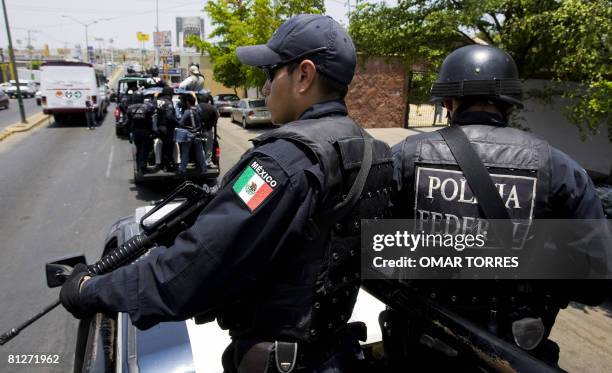 Members of the Mexican Federal Police arrive to patrol the city of Culiacan to reinforce the surveillance operation against drug trafficking in...