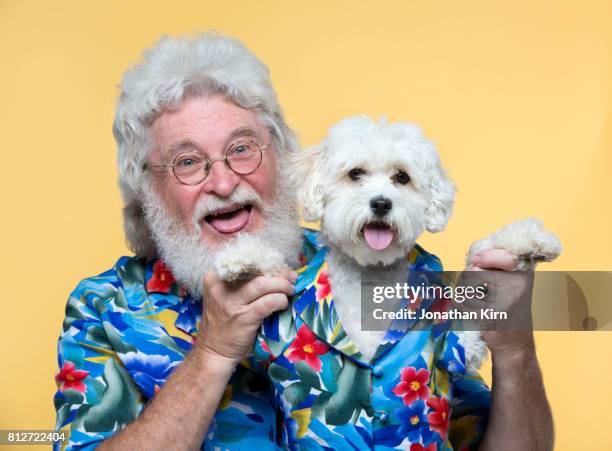 senior man with look alike dog. - huisdierenkleding stockfoto's en -beelden