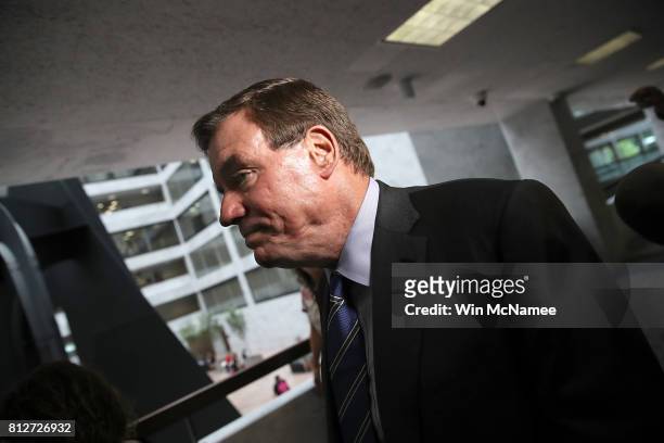 Sen. Mark Warner , ranking member of the Senate Select Committee on Intelligence, finishes speaking with reporters before a closed committee meeting...