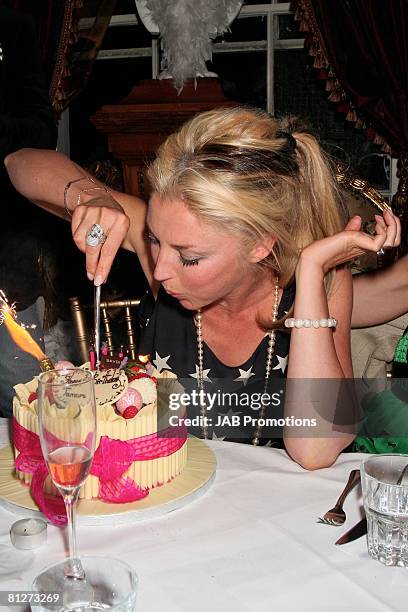 Tamara Beckwith cuts the cake at her birthday party hosted by the Supper Club London at Beach Blanket Babylon on May 28, 2008 in London, England.