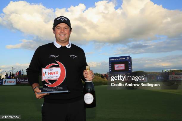 Patrick Reed of the USA poses with the trophy after winning The Hero Challenge during the AAM Scottish Open at Dundonald Links Golf Course on July...