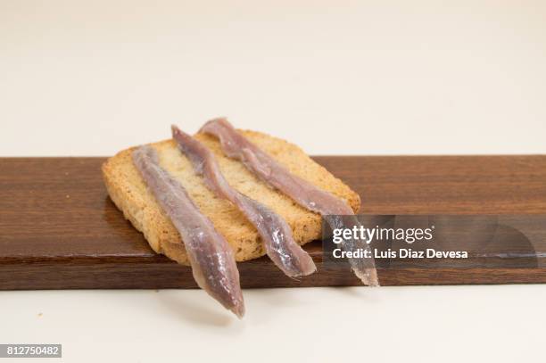 toasted bread and anchovies - anchovy fotografías e imágenes de stock