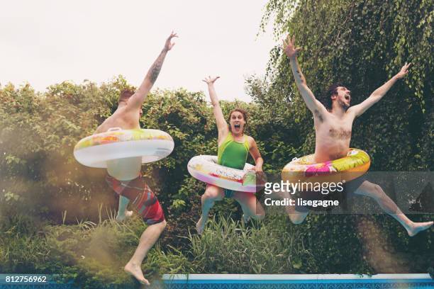 friends during a summer day - man on float stock pictures, royalty-free photos & images
