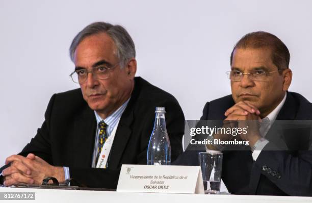 Jose Sette, executive director of the International Coffee Organization, left, and Oscar Ortiz, El Salvador's vice president, listen during the World...