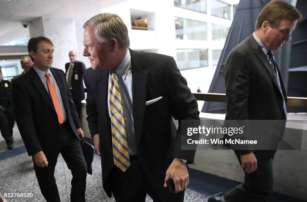 Sen. Richard Burr , chairman of the Senate Select Committee on Intelligence, and Sen. Mark Warner , ranking member of the committee, depart a closed...