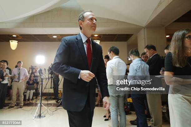 House Intelligence Committee ranking member Rep. Adam Schiff leaves after talking with reporters about the recent disclosure of a meeting between...