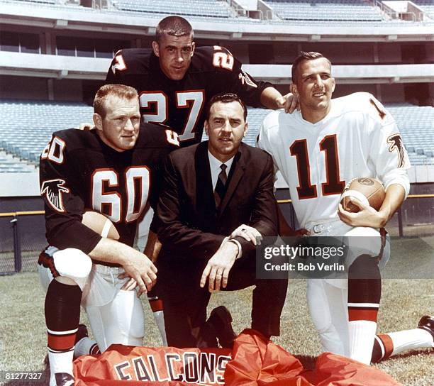 Atlanta Falcons linebacker Tommy Nobis , safety Nick Rassas head coach Norb Hecker, and quarterback Randy Johnson circa 1966.