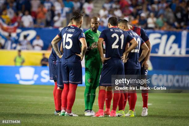 Members of the Costa Rica team huddle at the start of the Group A CONCACAF Gold Cup Match between Honduras and Costa Rica at the Red Bull Arena on...