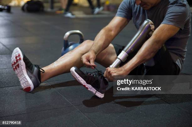 Man with leg amputated in the gym