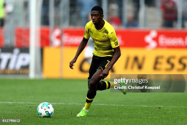 Ousmane Dembele of Dortmund runs with the ball during the preseason friendly match between Rot-Weiss Essen and Borussia Dortmund at Stadion Essen on...