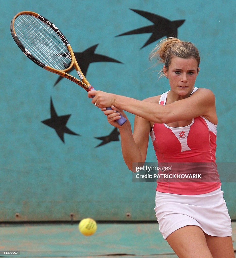 French player Olivia Sanchez hits a ret