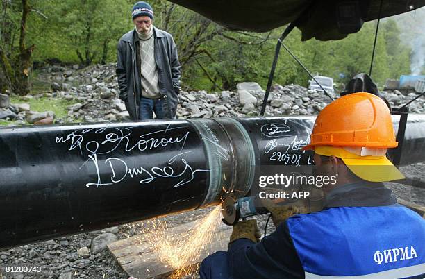 Worker welds a gas pipeline Dzuarikau-Tskhinval at the North Ossetia and South Ossetia border near a village of Kvaisa some 230 km outside...