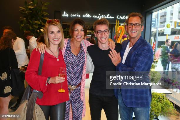 July 11: Andrea Luedke, Gerit Kling with son Leon and partner Stefan Henning pictuerd during the 'Kians Garden Flower Shop' Opening Event at...