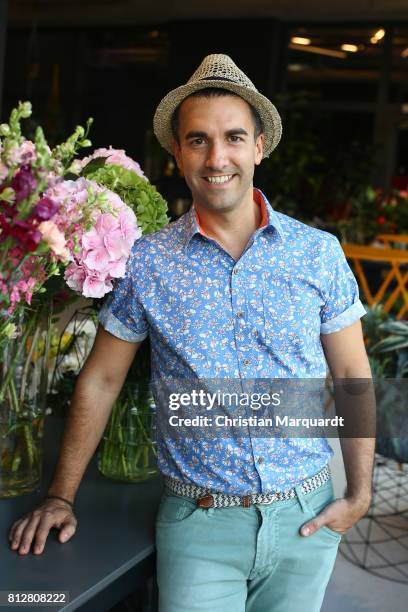 July 11: Kian Shams-Dolatabadi poses for a portrait during the 'Kians Garden Flower Shop' Opening Event at Kantstrasse on July 11, 2017 in Berlin,...