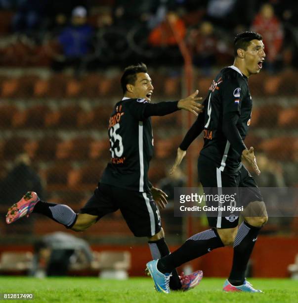 Oscar Cardozo of Libertad celebrates with teammate Angel Cardozo Lucena after scoring the opening goal of his team during a first leg match between...