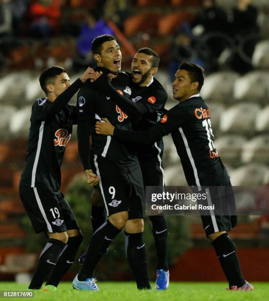 Oscar Cardozo of Libertad celebrates with teammates Jesus Medina, Angel Cardozo Lucena and Antonio Bareiro after scoring the opening goal of his team...