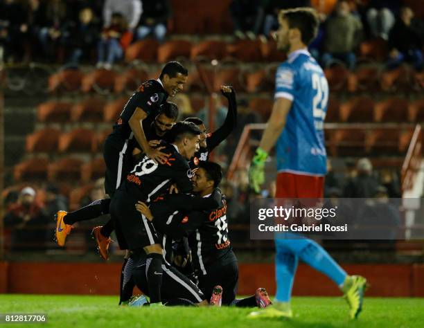 Oscar Cardozo of Libertad celebrates with teammates Jesus Medina, Angel Cardozo Lucena and Antonio Bareiro after scoring the opening goal of his team...