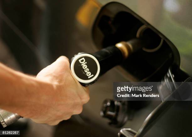 Driver fills up the tank of his car with diesel at a fuel station on May 29, 2008 in Luxembourg city. Customers are driving up to 100 km from...